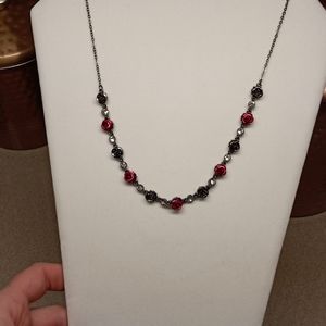 Gunmetal and red rose necklace.
